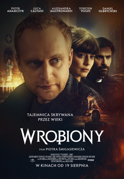 Piotr Adamczyk, Alessandra Mastronardi i Luca Calvani na plakacie promującym kinową emisję filmu „Wrobiony”, foto: Kino Świat
